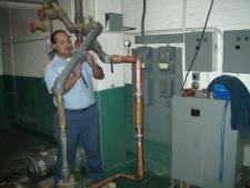 Apache Junction HVAC technician checks boiler line