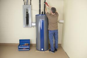 Apache Junction water heater repair technician at work on an intake line